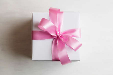 White gift box on white wooden tableの写真素材