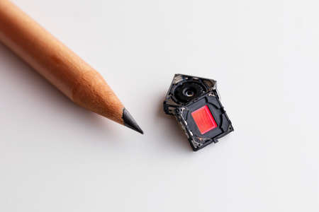 Small Digital camera lens and CCD compare with pencilの写真素材