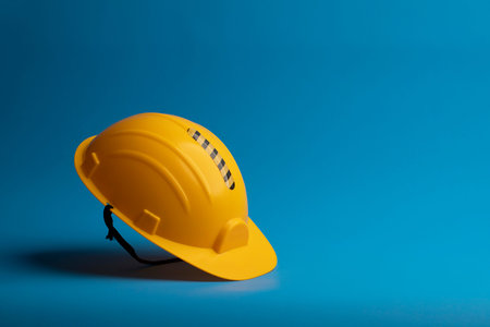 Yellow Safety helmet on blue background