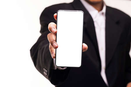 Businessman show display of smartphone with blank screen.の写真素材