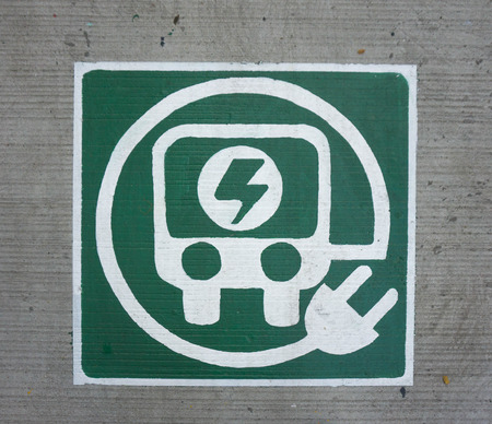 electric car logo in concrete floorの写真素材