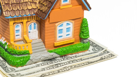House toy on money bank notes in white backgoundの写真素材