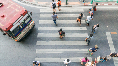 Bangkok,THAILAND - February 20, 2016.People are walking across road before the bus is going to stop at the crosswalk in top view. Bangkok, Thailand.のeditorial素材
