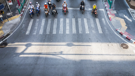 A aerial view of  the high traffic on a street intersection with crosswalk.の写真素材