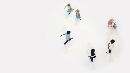 blur adult and chirld play and run on the white playground at the top aerial viewの写真素材