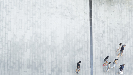 the group people of women and men walking fast on the pedestrian street city in the summer season. (top view image)の写真素材