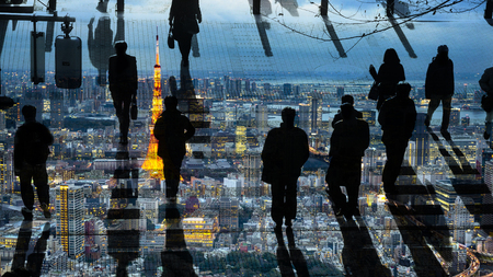silhouette people walk on pedestrian crosswalk with the overlay nighttime modern city(top aerial view)の写真素材