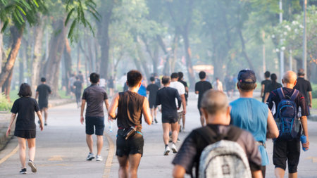 view of back of people run and walk at pedestrian garden parkのeditorial素材
