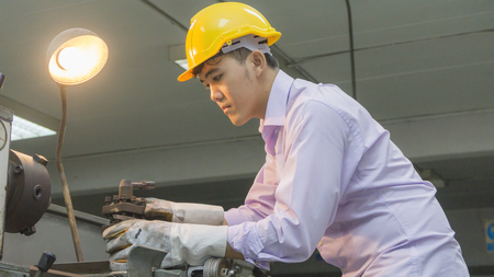 worker use bending machine with steel pipe. Metal working conceptの写真素材