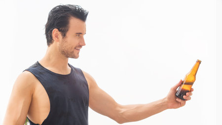 black glasses man with beverage of bottle of beer in white sky backgroundの写真素材