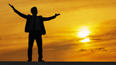 business man run with laptop briefcase at pedestrianの写真素材