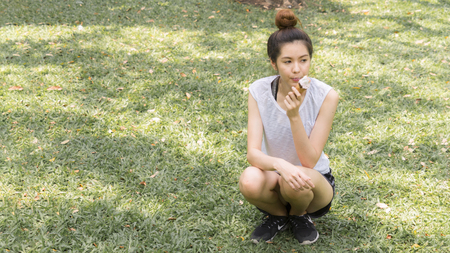 cute girl eat ice cream in close up face feeling deliciousの写真素材