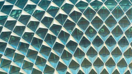 pattern exterior faÃ§ade in triangle pattern with shadding and glass wallの写真素材