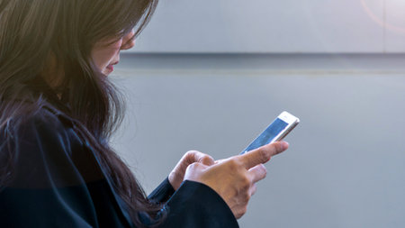 close up lady hand with texting on smartphone.