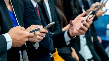 close up businessman hands with texting on smartphone.の写真素材