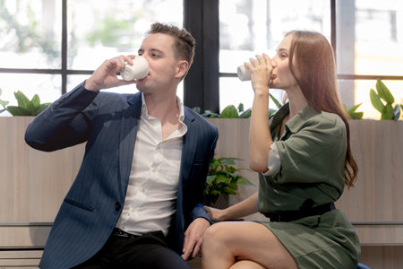 Portrait of happy businessman and woman hold cup of coffee at coffee cafe counter bat with nature biophilia for wellness life.の写真素材