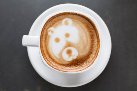 A cup of coffee with bear imageの写真素材