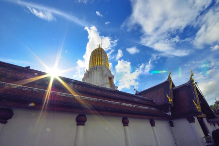 Thai art on roof and pragada at Thai templeの写真素材