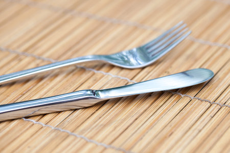 knife and fork on bamboo tray 