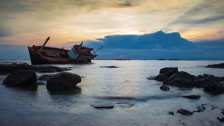 crash boat on sea during sunset.の写真素材