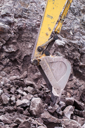 Excavator in the rock mine.の写真素材