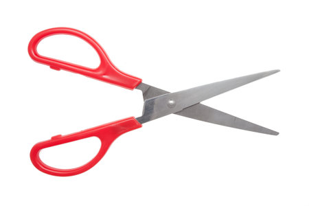 Red scissors isolated on white background without shadows.