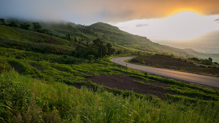 Road on mountain and sun.の写真素材