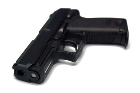 Modern black pistol isolated on white backgroundの写真素材