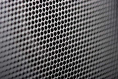 Grille of speaker close-up horizontal photo. Focus on center image.の写真素材
