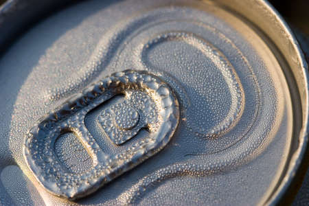 Aluminium can of beer with dropless. Close-Up photo in evening sun rays.の写真素材