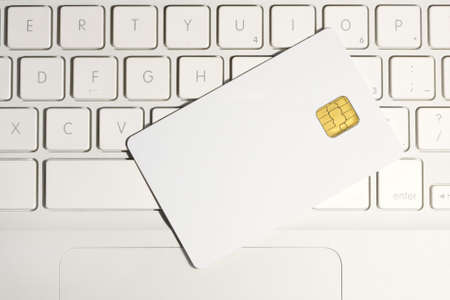 Modern security. Smart card close-up on white laptop.の写真素材