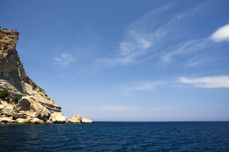 Mediterranean seascape. Rocks, sea and sky in sunny summer day.