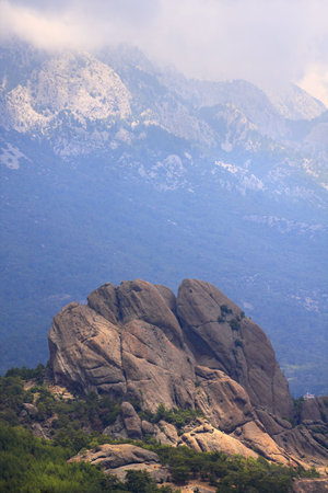 Mountains and rocks of Mediterranean on a misty day