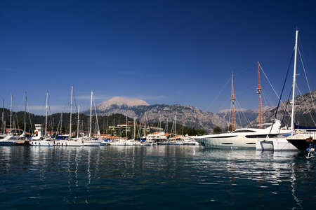 White ships at harbor on a background mountains in a sun summer morning. の写真素材