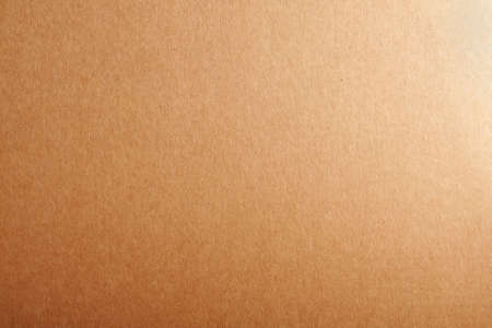 Blank beige cardboard textured background.の写真素材