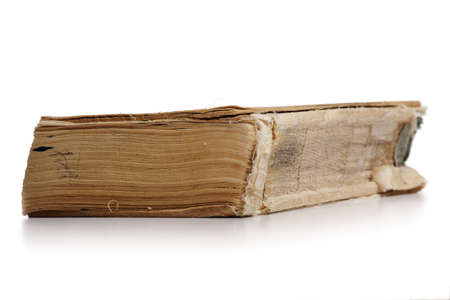 a very old book isolated on white backgroundの写真素材