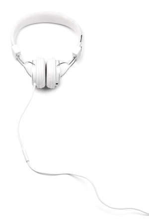 White elegance headfones with cord isolated on white background. White on white series. Vertical composition.の写真素材