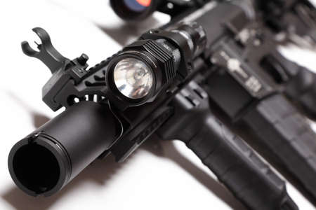 M4A1 carbine with RIS/RAS forearm and tactical flashlight. Shallow DOF.の写真素材