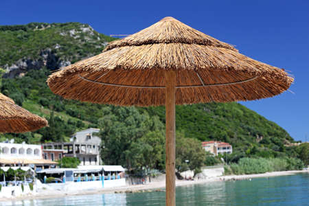 Umbrella on a Mediterranean beach. Corfu Island, Greeceの写真素材
