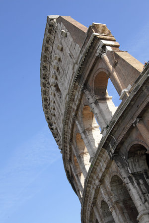 Colosseum against a blue sky. Low angle, tilt view. Rome, Italy