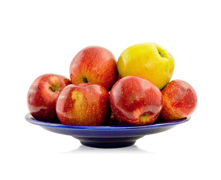 ripe apples on a blue platter - isolated on whiteの写真素材