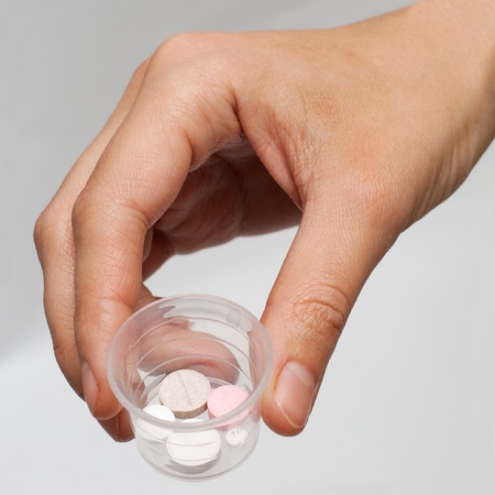 lot of different pills in the handの写真素材