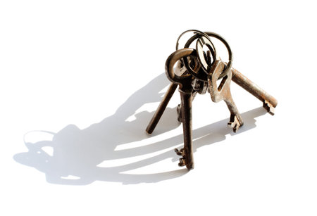 bunch of old keys isolated on white background with shadow
