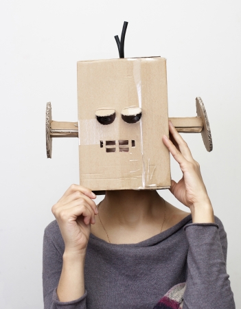 Robot Girl  Woman with a cardboard box on his head の写真素材