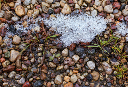 the snow melts in the spring of colored stones