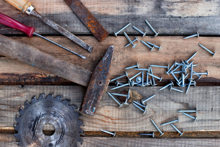 carpentry tools lie on the old wooden boards.の写真素材