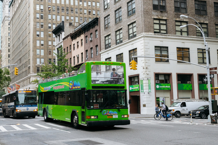 New York, USA - September 22, 2015:  Tourist green bus on the street of New York.のeditorial素材