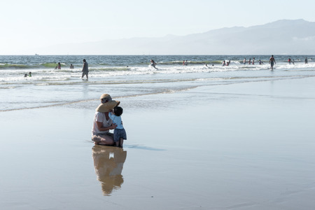 Los Angeles, USA - September 27, 2015: People are walking on Venice beach, California.のeditorial素材