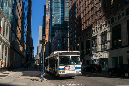 New York, USA - September 20, 2015:  Bus and bicycle near skyscrapers on the street of New York.