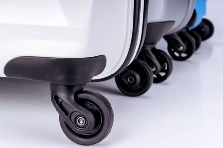 Suitcases on wheels of different colorsの写真素材